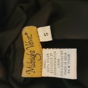 This is a beautiful black beaded gown for a formal event. Maybe a prom.